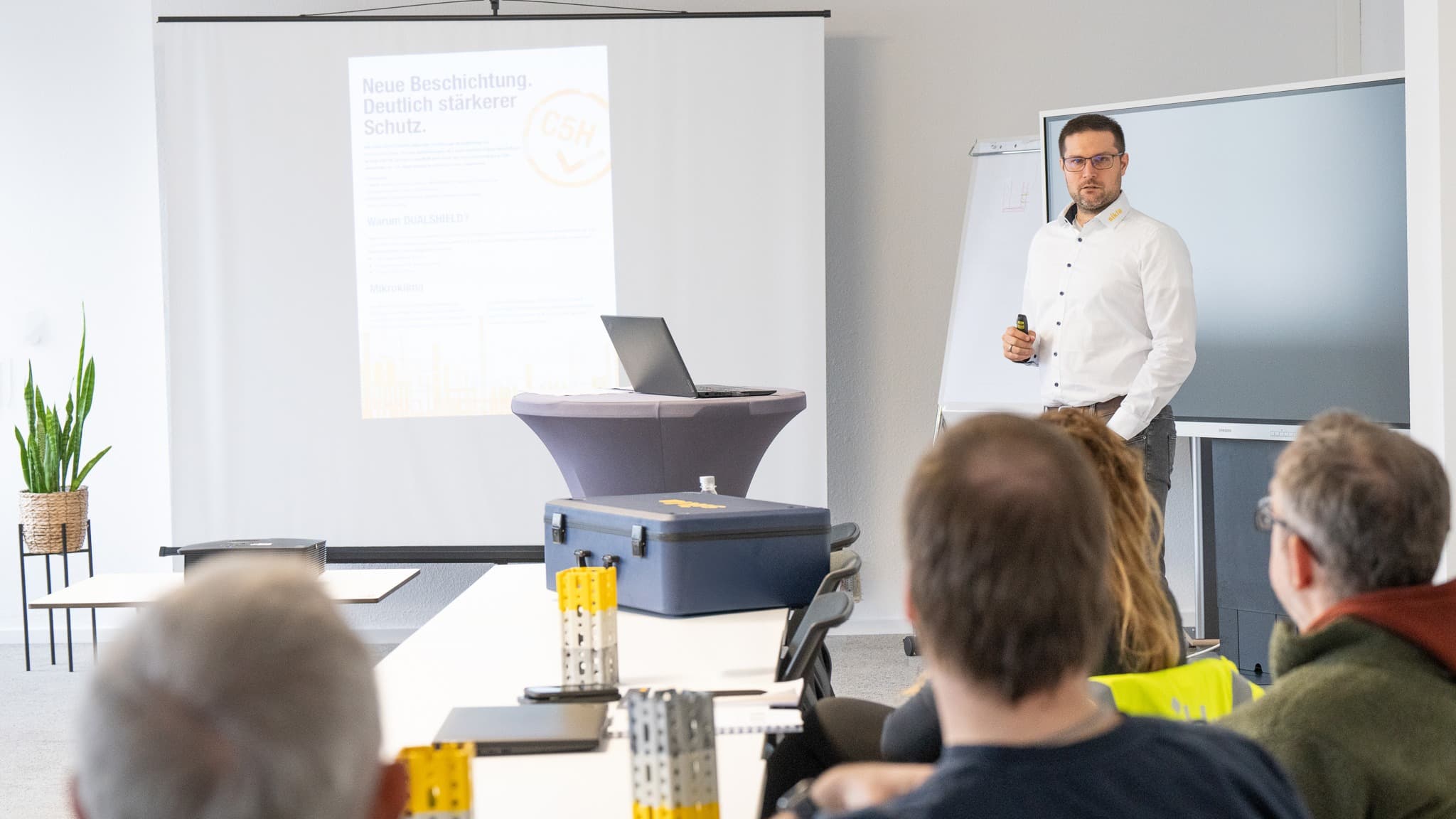Person standing in front of people, doing a Sikla product training